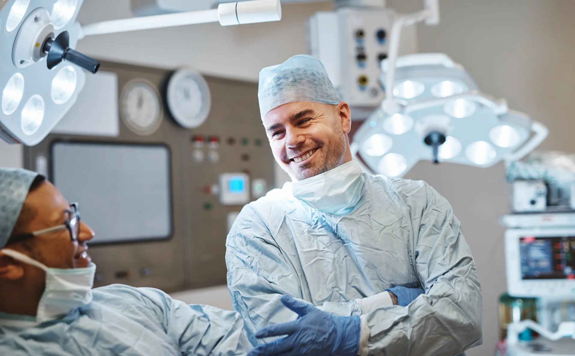 Confident surgeon in a high-tech operating room preparing for a precision procedure