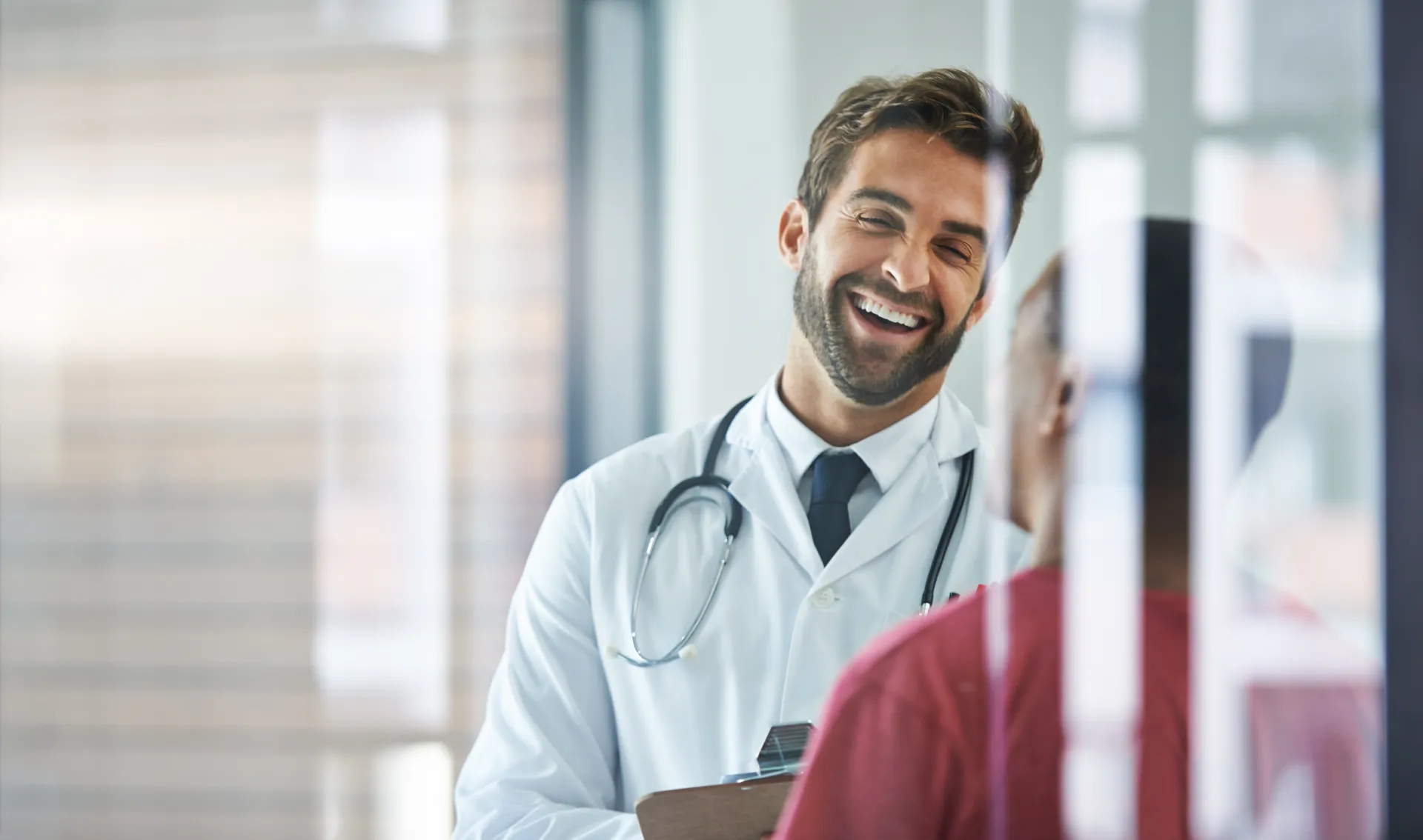 Confident physician in a modern facility reviewing hair restoration patient results