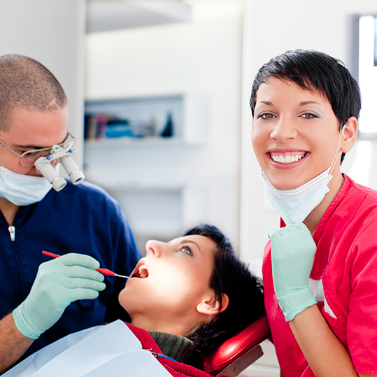 happy and successful dentist and dental assistant